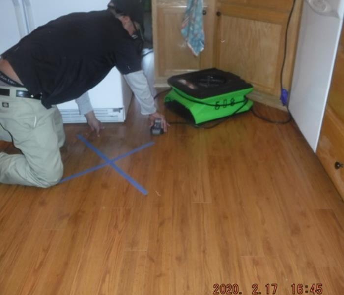 Before affected kitchen flooring was removed 